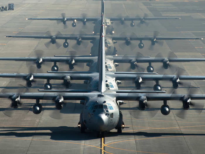 Six C-130 Hercules line up before flying a sortie during a readiness week at Yokota Air Base, Japan. The 374th Airlift Wing uses C-130s to support combatant commanders in the Pacific. (U.S. Air Force photo/Senior Airman Cody H. Ramirez)