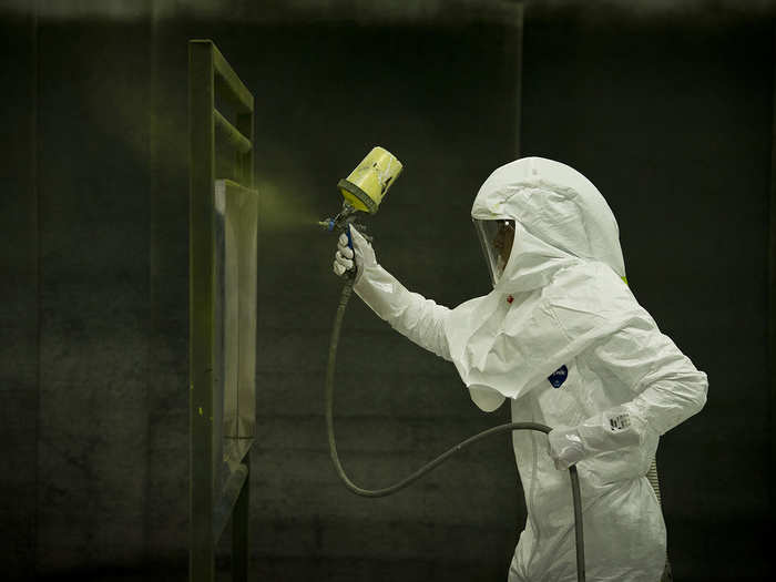 Nathan Lancaster paints an oil pan for aircraft maintenance at the 403rd Maintenance Squadron fabrication shop at Keesler Air Force Base, Miss. Lancaster, a sheet metal technician, and his team use an average of 15 to 20 quarts of paint a week for materials and aircraft. (U.S. Air Force photo/Senior Airman Andrew Lee)