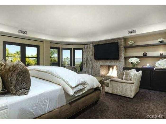 The master suite has a fireplace, sitting area, terrace, and three walk-in closets.