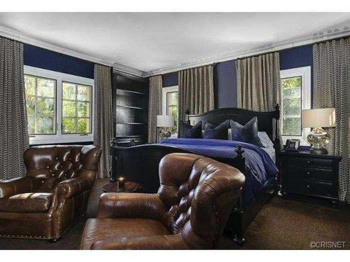 Another bedroom has luxurious purple and leather decor.