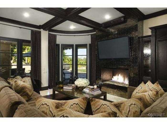 Cozy up by the fire in this comfortable family room, the key to surviving those cold southern California winters.
