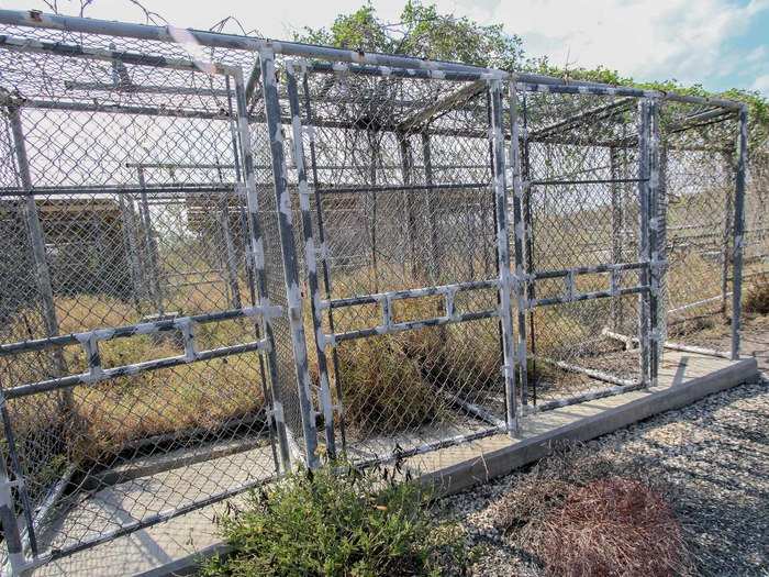 Contractors were still welding these showers when the first detainees arrived.