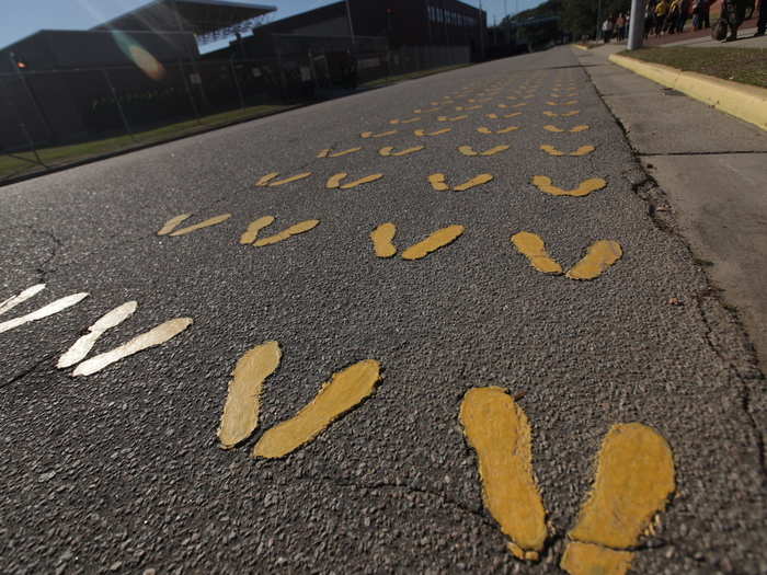 Once they arrive, the first thing they do is shuffle off the bus and line up on the famous yellow footprints.