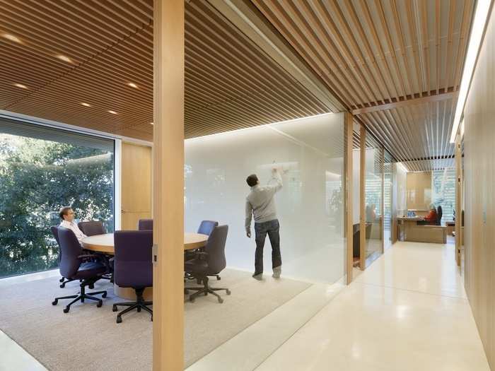 The headquarters of an undisclosed Silicon Valley venture capital firm were redesigned with gardens, wood finishes, and plenty of glass to create an understated, intimate work environment. (Paul Murdoch Architects; Kappe Architects Planners)