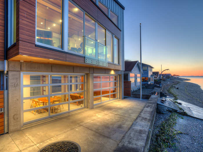 The waterfront home has beautiful views of the Puget Sound but is located in an area prone to earthquakes, severe winds, and flooding.