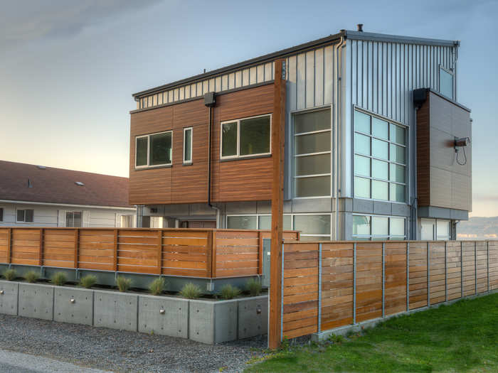 A large sand filter drain was constructed and then hidden by a sun deck. From the road, concrete and wood barriers block views to the 3-foot-high sun deck.