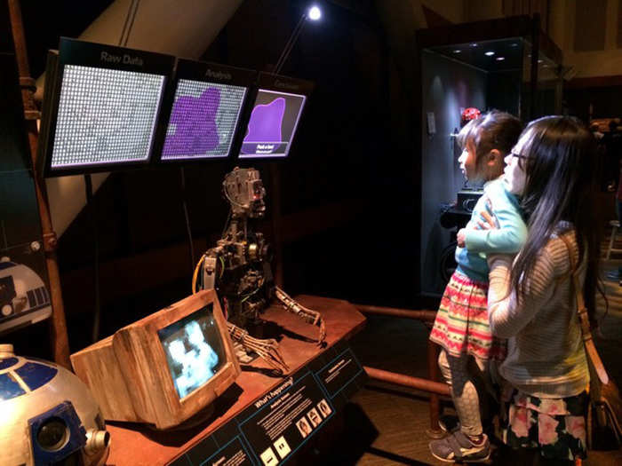 There were a bunch of cool learning activities for kids and adults alike throughout the exhibit. My favorites were the machine vision booth, where kids could interact with a droid and see what it sees...