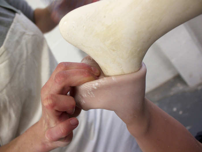 The limb-creation process starts with a foam shape that mimics the client