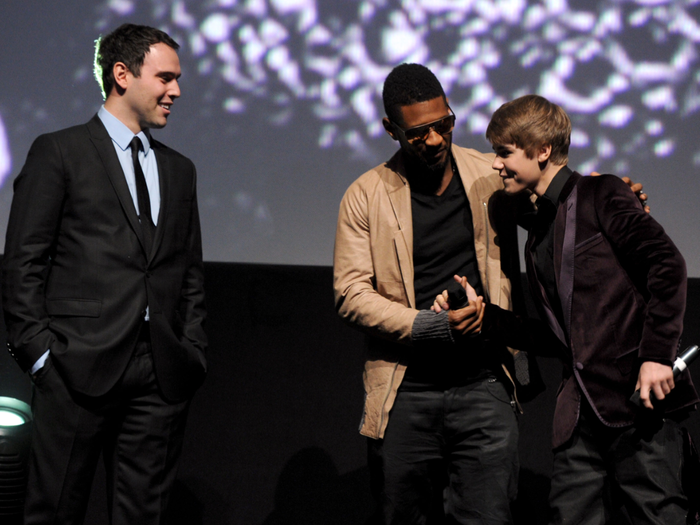 2008: A week after arriving, Bieber sang for Usher in a recording studio parking lot. The 13-year-old was soon signed to Raymond Braun Media Group (RBMG), a joint venture between Braun and Usher.