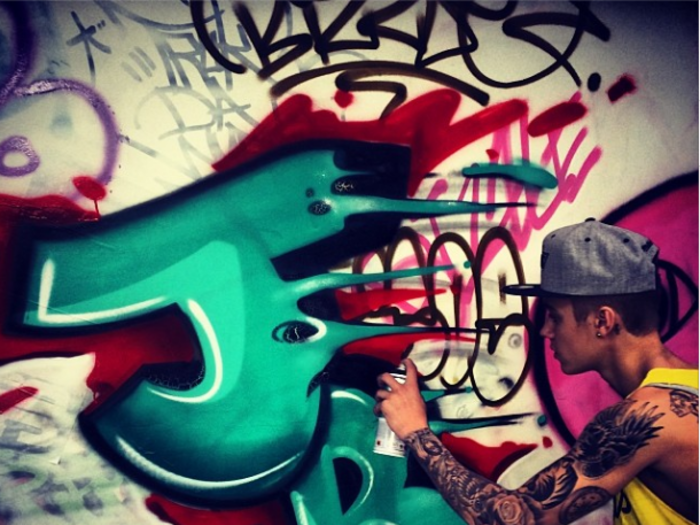 November 2013: Justin gets in trouble for spraying graffiti on an Australia hotel.