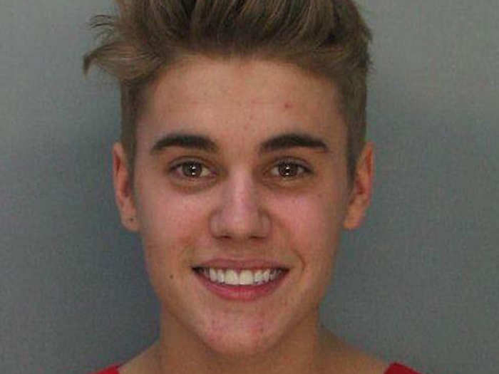 January 2014: Justin is arrested for DUI and drag racing in Miami, Fl. but manages to smile for his mugshot.