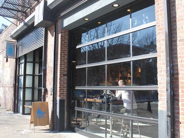 The cafe is housed in an early 20th-century brick building that, according to Blue Bottle