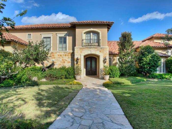 The stone walkway leading to the entrance of the home.