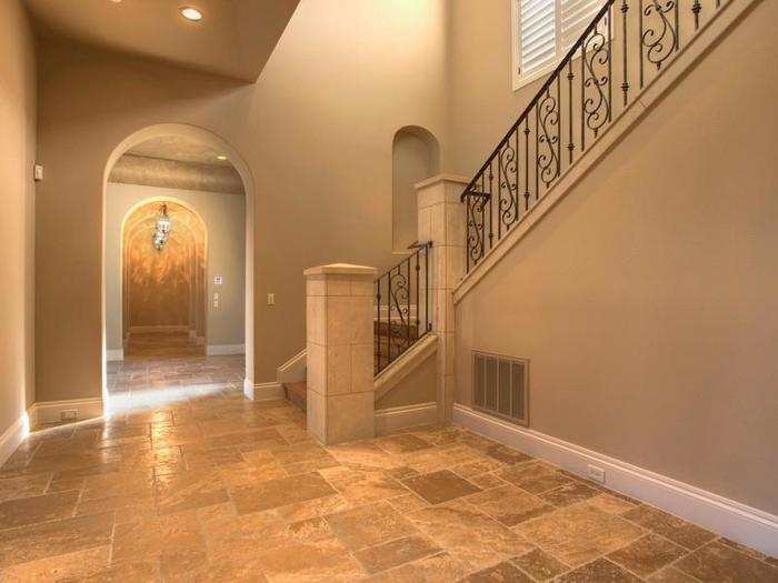 The fancy staircase with Mediterranean-style decor.