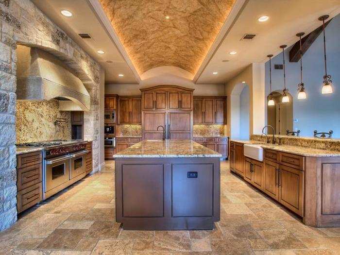 Here is the gourmet kitchen complete with stone walls, floors, and marble countertops.