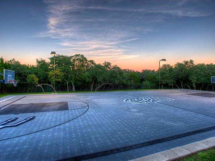 Of course, an outdoor full-scale basketball court with the Spurs logo stamped in the middle.