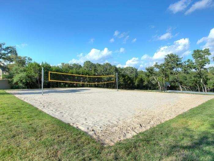 The yard is also complete with this full-size sand volleyball court!