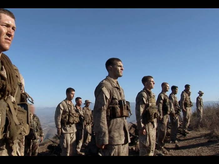 Ragged, dirty, and exhausted, they top a hill at dawn and get into formation — graduation commences on the spot