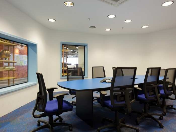 A handful of boardrooms fill the central wooden rooms on each floor.