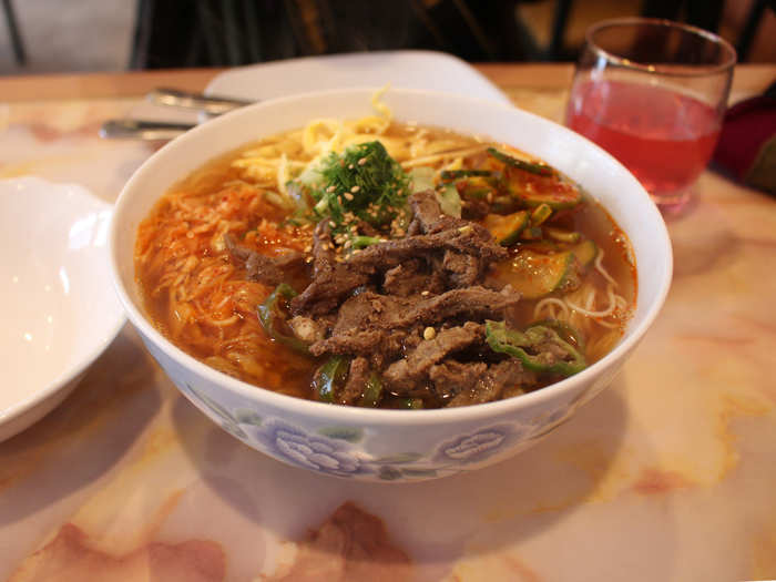 The Korean dish Kuksu ($5.50) is a beef noodle soup topped with sesame seeds, pickled cucumber, dill, and cabbage. We wanted a straw to finish off that savory broth.