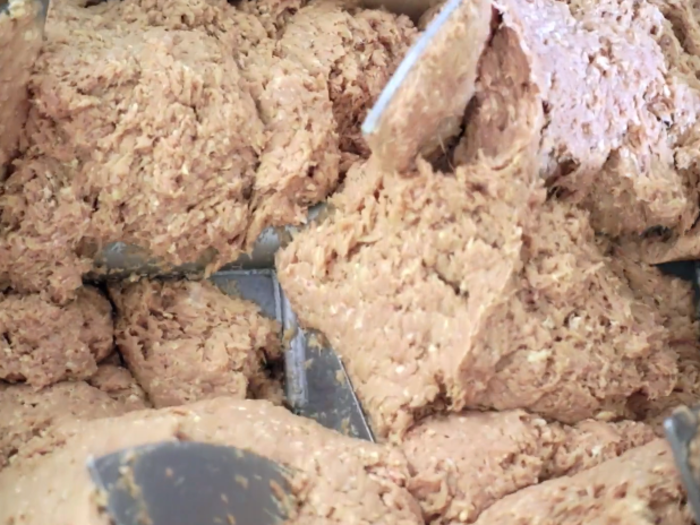 Inside the blender, the ground chicken meat is mixed with some seasonings and chicken skin for flavoring.