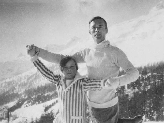 Eleven-year-old Sonja Henie stands with world champion figure skater Gilles Grafstrom at the 1924 Games. Gramstrom won the Olympic gold while Hennie would go on to win the gold in 1928, 1932, and 1936.