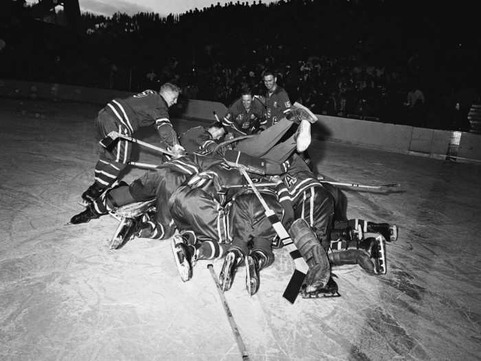 Later called "The Forgotten Miracle," the U.S. Ice Hockey win over Canada for the Olympic Gold in 1960 was as incredible as the later game in 1980. Here, the team piles on the puck a moment after winning; American coach Jack Riley is in the middle of the pile.