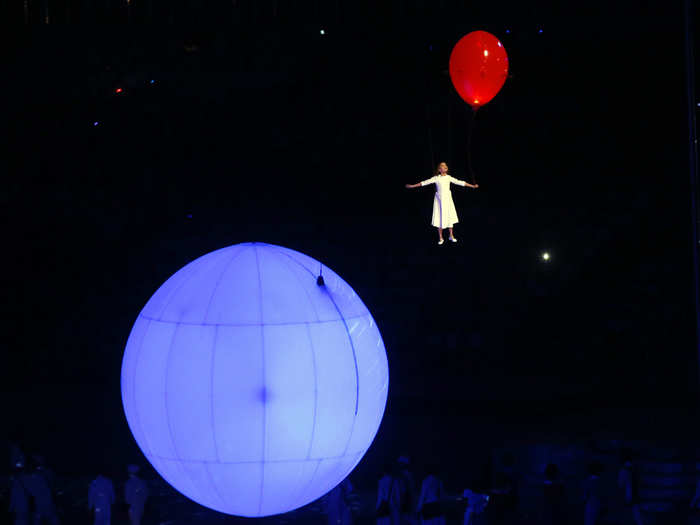 A little girl floating in the center of the arena.