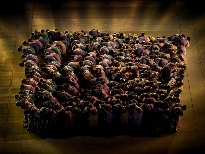 Dancers make a human square.