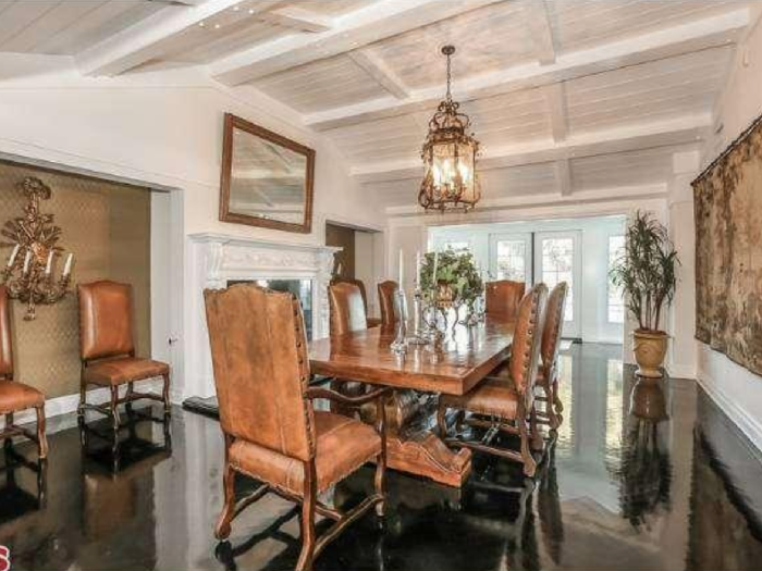 For more formal dinners, the home has a dining room that can seat over eight guests, complete with another fireplace.