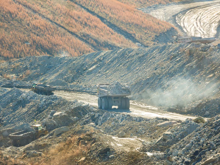 The remaining stone, called overburden, is carted off for disposal.