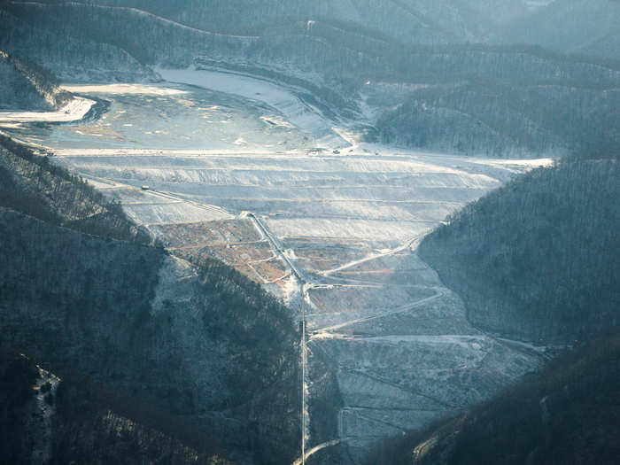 The rock is used to build dams or "valley fills" that hold back up to millions of gallons of coal waste called "slurry."