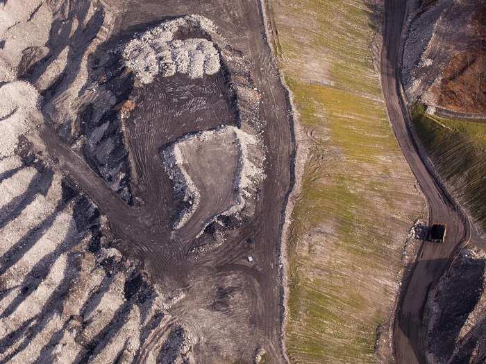 Once the hydroseed takes hold a flush of green will coat the mountain debris giving it a life-sustaining appearance.