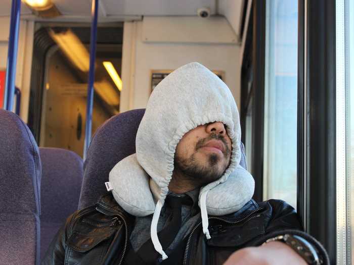 Travelers can shut out unwanted light with the Hoodie Pillow.