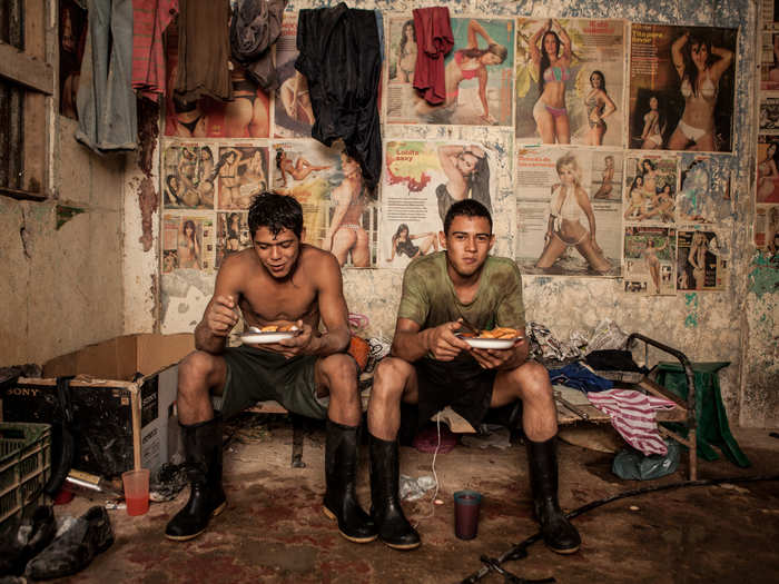 Gold miners of the Abangares gold mine in Costa Rica eat dinner.