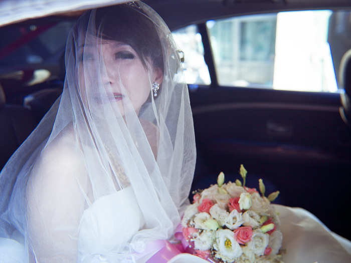 A bride in Taiwan breaks down crying.