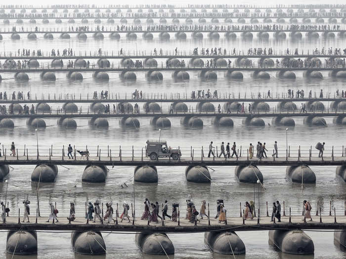 Pilgrims and devotees gather to bathe in a sacred river on Maha Kumbh Mela, the largest spiritual gathering in the world.