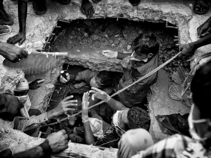 Thousands of mourners gather at the ruins of a collapsed garment factory outside Dhaka, Bangladesh.