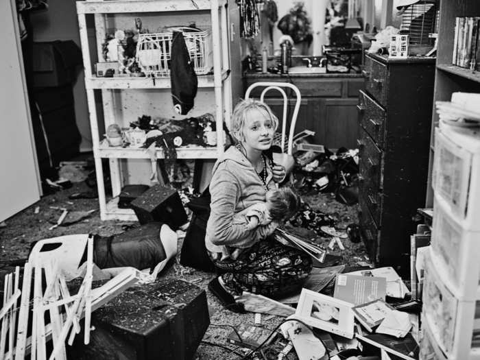 Destiny Pierman, 13, collects her belongings from her bedroom in her tornado-ravaged home in Moore, Oklahoma.