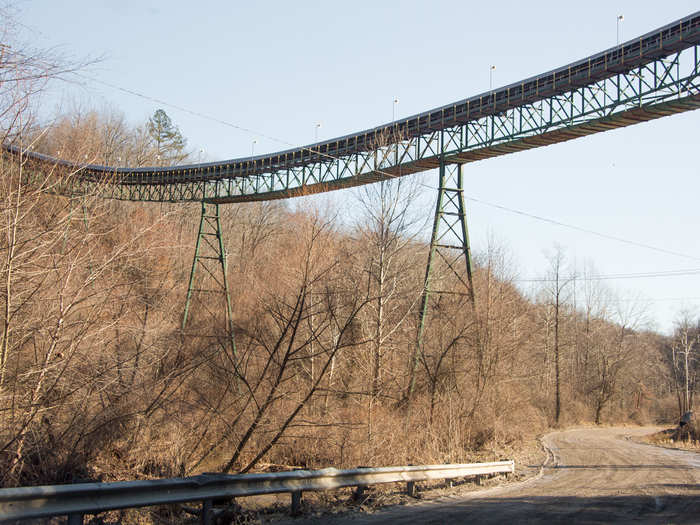 Conveyor belts carry coal to them for miles.