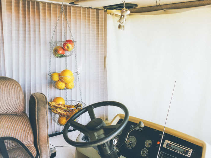 Many of the people who are living in their vehicles by choice modify their car to bring domestic conveniences like this fruit basket.