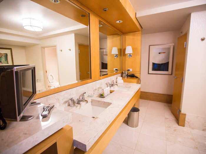 The bathroom has a deep soaking bath and shower for two, plus a 500 square-foot separate powder room. The vanity even has its own personal TV.