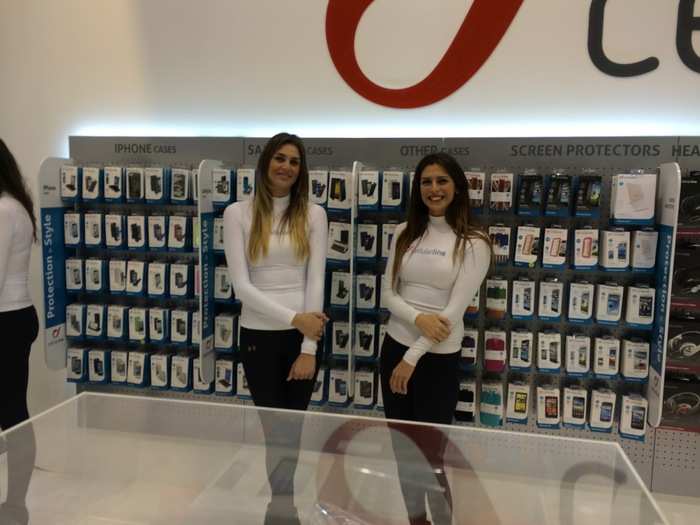 Women in front of iPhone cases.