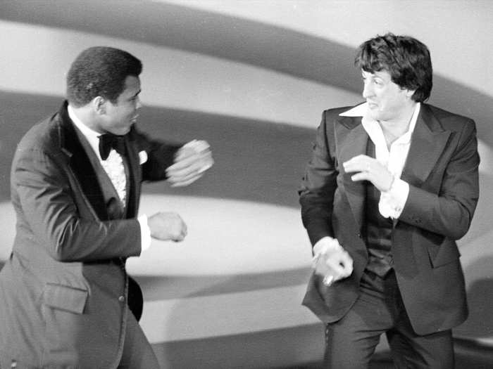 Heavyweight champion Muhammad Ali ambushed Sylvester Stallone as he was presenting an award. "I