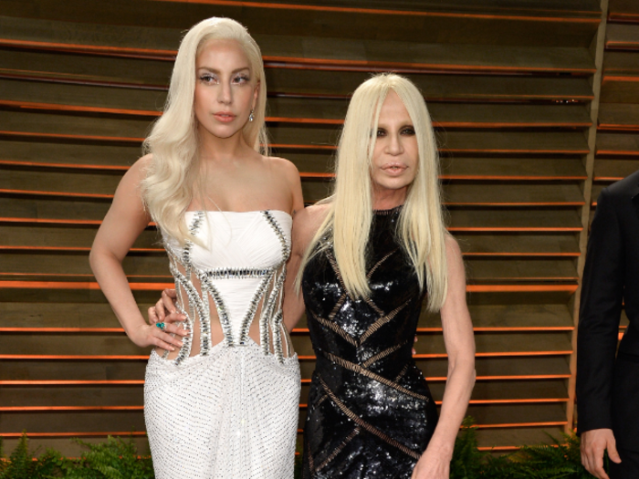 Lady Gaga arrived with Donatella Versace, wearing her design.