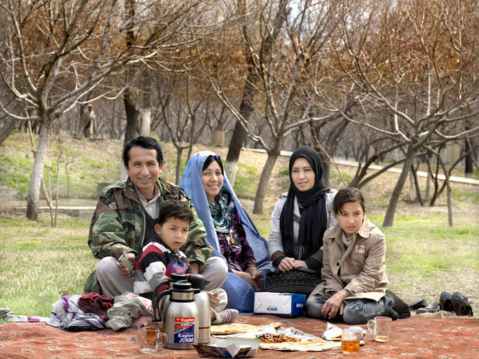 Maize (wearing the blue burqa) lives in a village 15 hours outside of Kabul, but came to visit her husband, an army officer stationed in the city. They picnicked for the day at her favorite place, Bagh-e Babur Gardens, a historic park built in 1528.