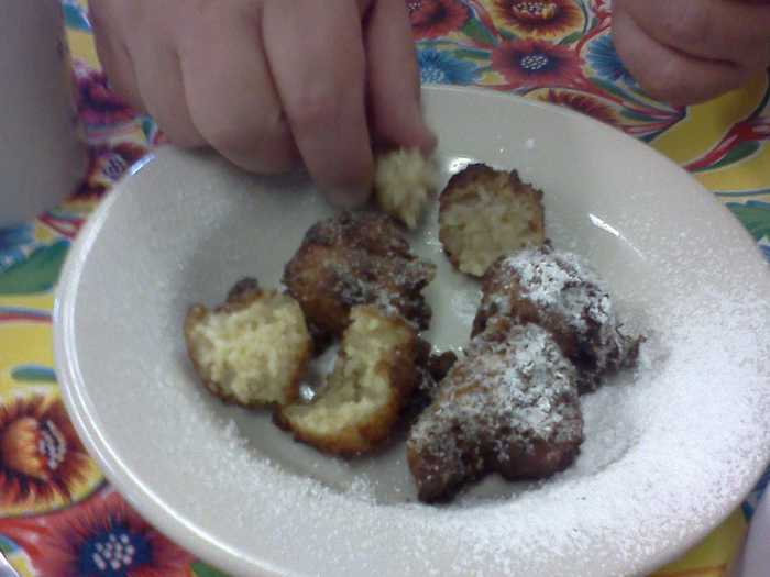 Calas: Deep fried rice cakes made with sugar, flour, eggs and rice, then dusted with powdered sugar. Traditionally eaten at breakfast.