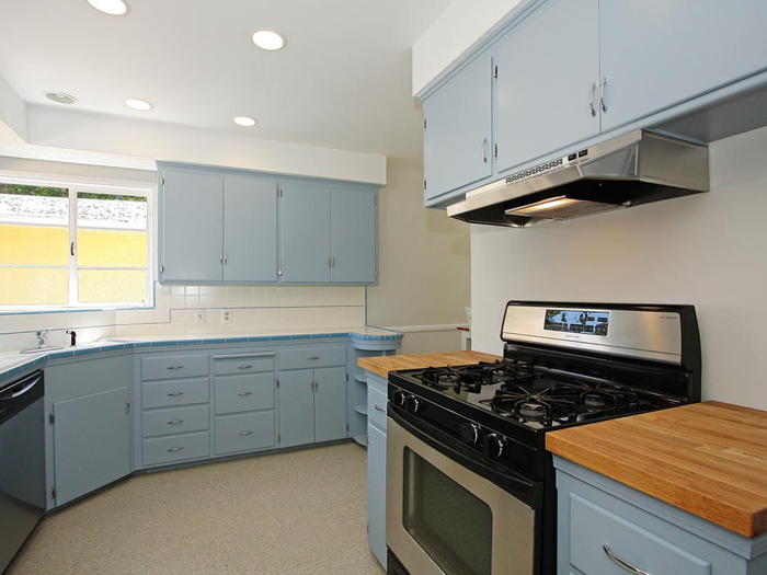 The pale blue cabinets in the kitchen are pretty old-school.