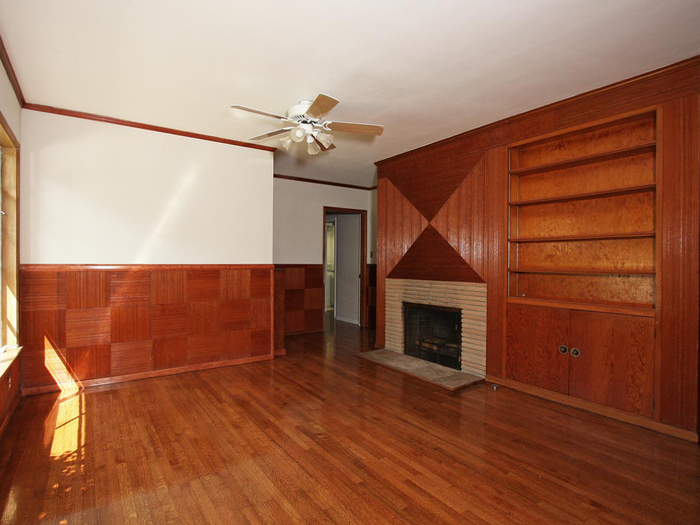 Wood panelling covers the walls in the living areas.