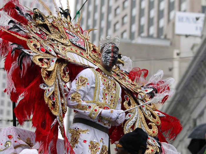 The King of the Krewe of Zulu leads his section in the Mardi Gras Day parade.